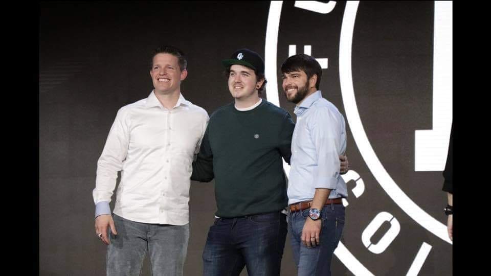 Jack Goddard on stage at ClickFunnels with Russell Brunson and Todd Dickerson